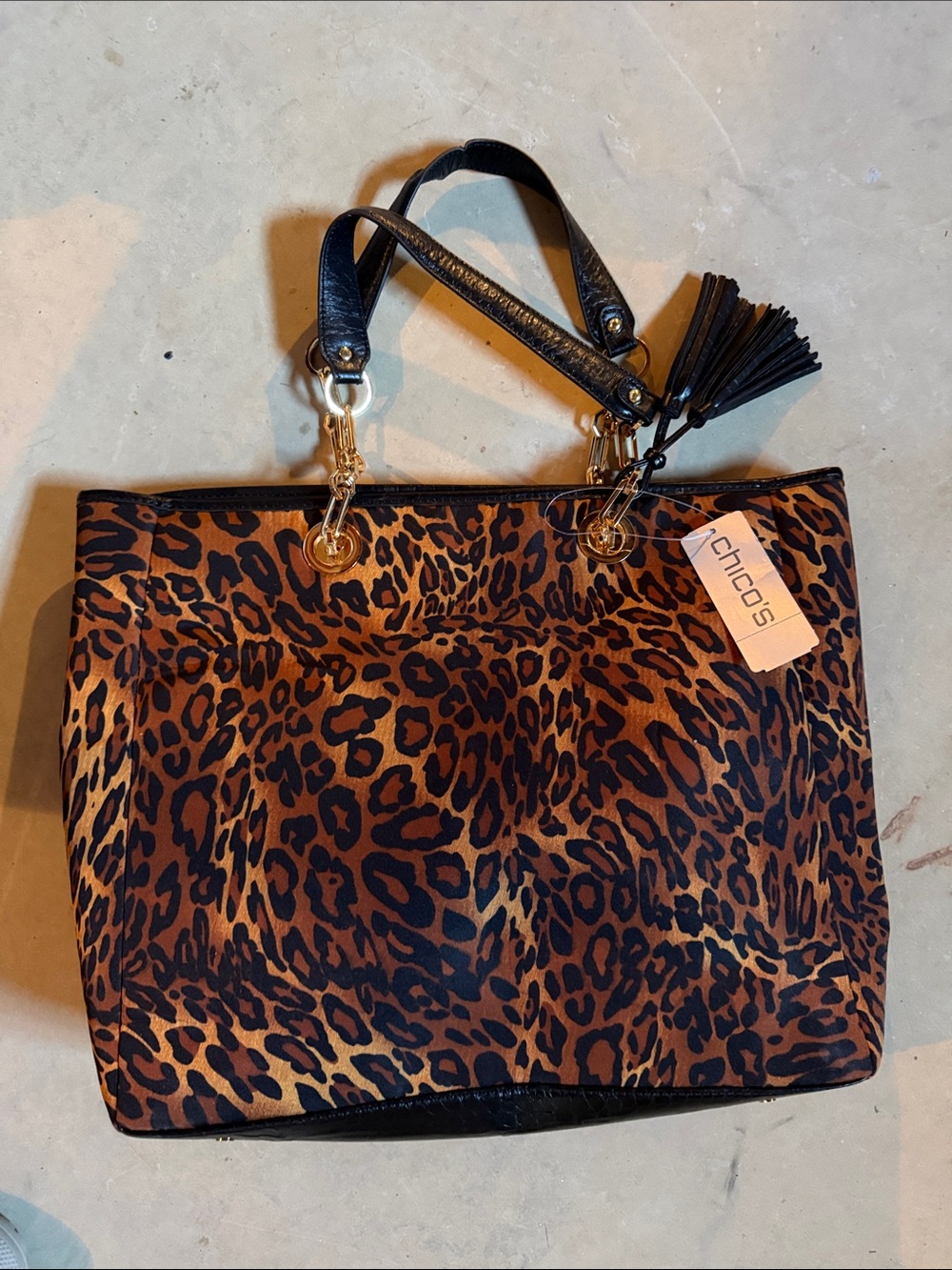 NWT. Never used. Chico's Leopard Print Tote in Brown & Black with Tassel. Gold